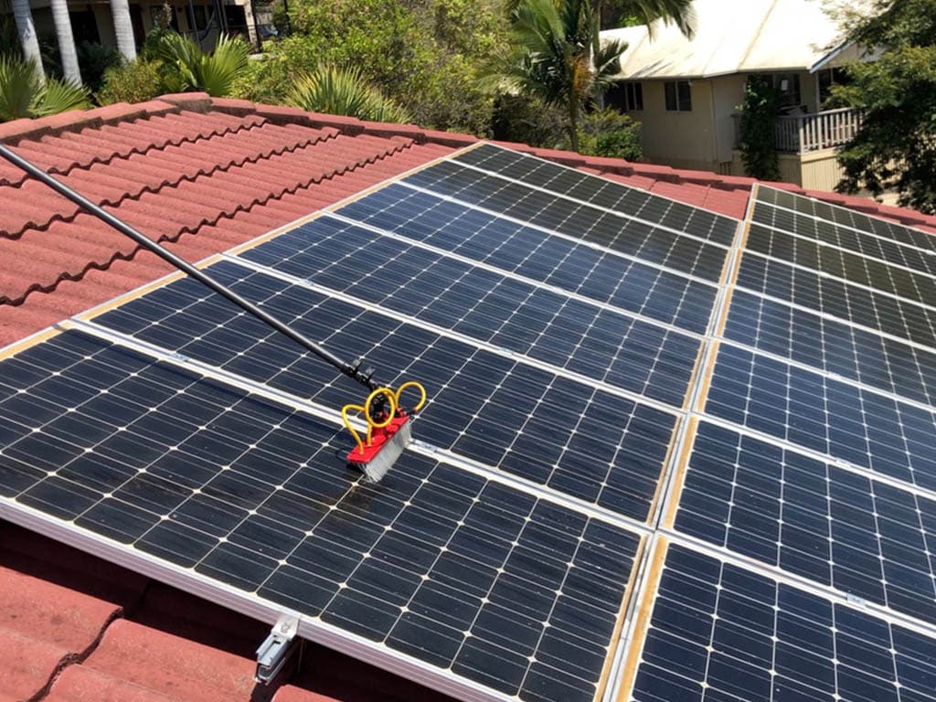CEE8AB6A-14C3-45FE-96F8-5FBC0B54087A_1_105_c Solar panel cleaned using a brush pole rigged with water pump