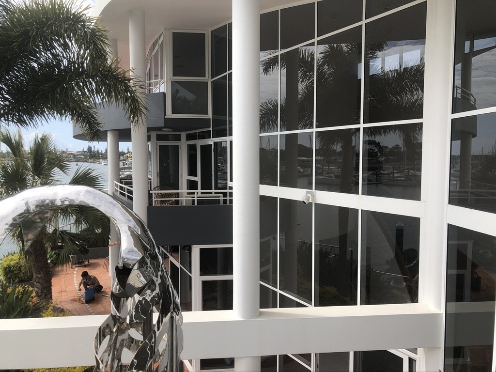 Establishment with glass walls being cleaned by a professional window cleaner