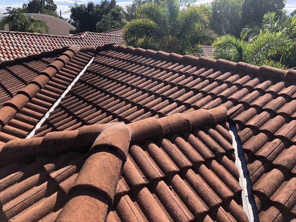 Dirty clay roofing that needs roof cleaning